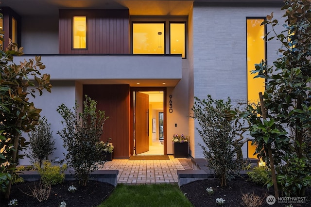 9630 SE 5th St, Bellevue, WA 98004 - view of front of house with a balcony and stucco siding