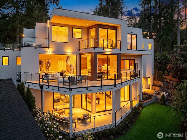 9630 SE 5th St, Bellevue, WA 98004 - back of house featuring a balcony, stucco siding, and a lawn