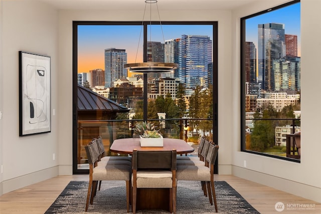 9630 SE 5th St, Bellevue, WA 98004 - dining area with a skyline view and wood finished floors