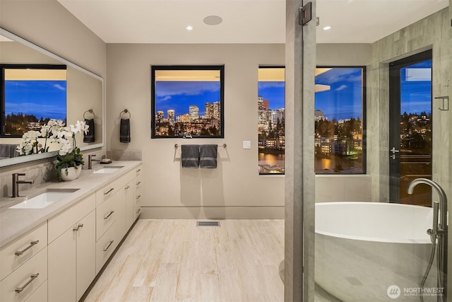 9630 SE 5th St, Bellevue, WA 98004 - bathroom with double vanity and a freestanding tub