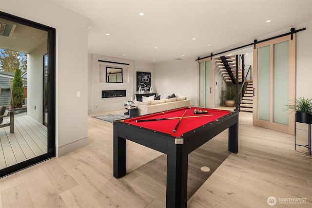 9630 SE 5th St, Bellevue, WA 98004 - playroom with a barn door, light wood-style flooring, billiards table, and recessed lighting
