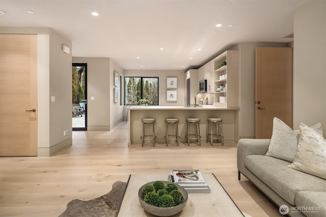 9630 SE 5th St, Bellevue, WA 98004 - living room featuring light wood-type flooring and recessed lighting