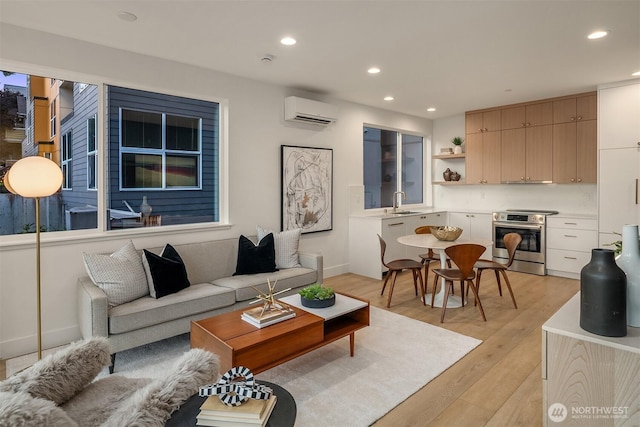 3608 Francis Ave N, Seattle, WA 98103 - living room featuring a wall mounted air conditioner, light wood-type flooring, and recessed lighting