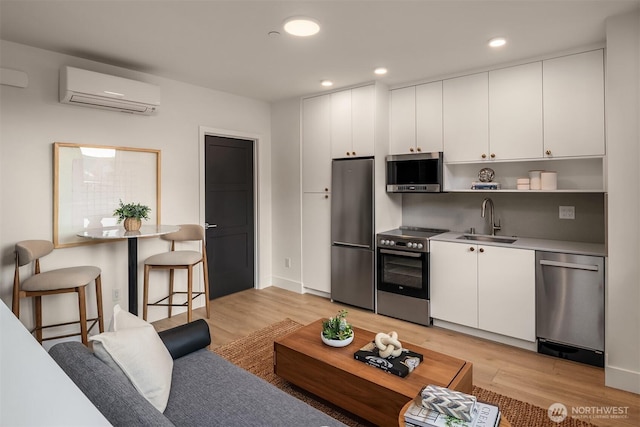3608 Francis Ave N, Seattle, WA 98103 - living area with a wall unit AC, light wood-style floors, and recessed lighting