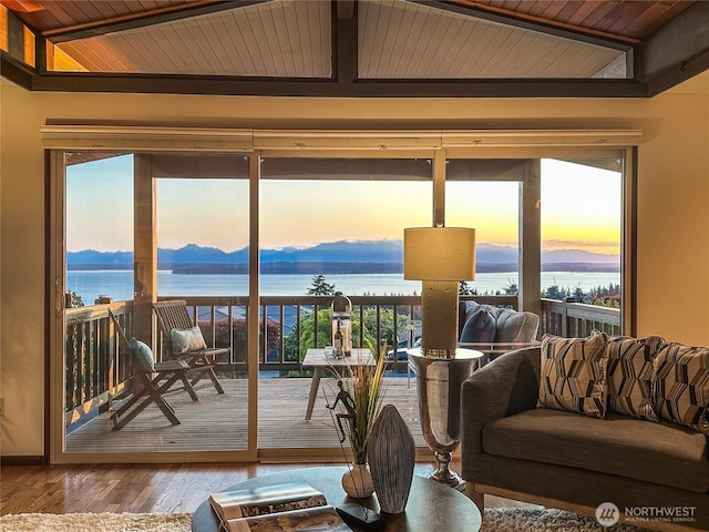 18354 Ridgefield Rd NW, Shoreline, WA 98177 - sunroom with a wood ceiling with exposed beams, a water and mountain view, and wood finished floors