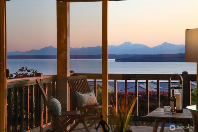 18354 Ridgefield Rd NW, Shoreline, WA 98177 - balcony at dusk with a water and mountain view