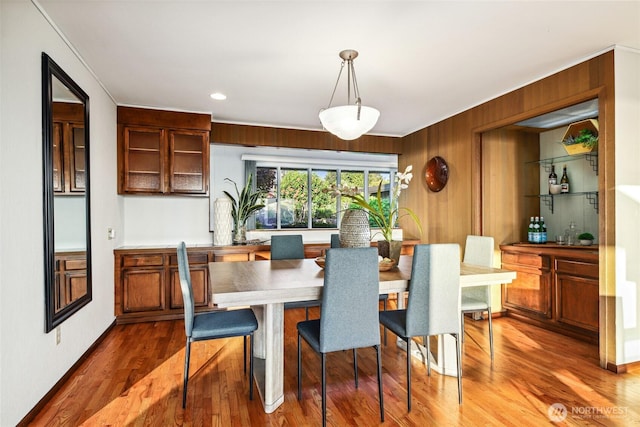 18354 Ridgefield Rd NW, Shoreline, WA 98177 - dining space featuring wood finished floors, ornamental molding, recessed lighting, and wood walls