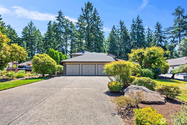 33202 2nd Pl SW, Federal Way, WA 98023 - view of property hidden behind natural elements with driveway and an attached garage