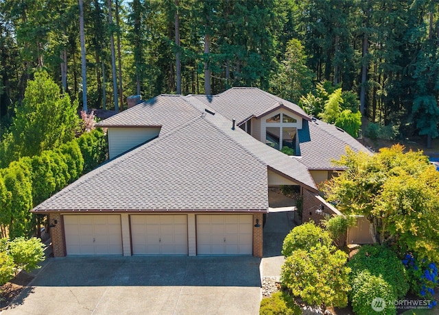 33202 2nd Pl SW, Federal Way, WA 98023 - view of front of property featuring brick siding, concrete driveway, a garage, and roof with shingles