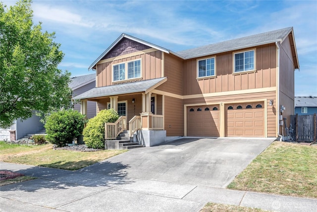 9211 Carys St SE, Yelm, WA 98597 - view of front facade with an attached garage, board and batten siding, driveway, a front yard, and roof with shingles
