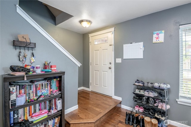 9211 Carys St SE, Yelm, WA 98597 - foyer featuring wood finished floors and baseboards