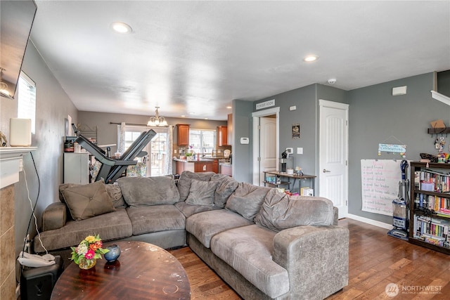 9211 Carys St SE, Yelm, WA 98597 - living room with wood finished floors, recessed lighting, and a chandelier