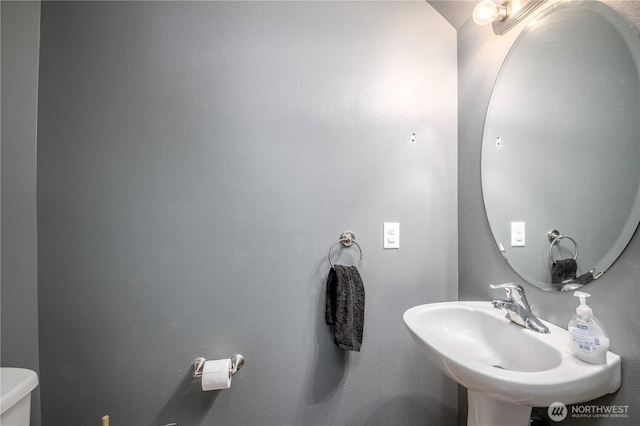 9211 Carys St SE, Yelm, WA 98597 - half bathroom with a sink and toilet