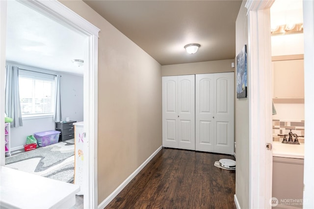 9211 Carys St SE, Yelm, WA 98597 - hallway featuring dark wood finished floors and baseboards