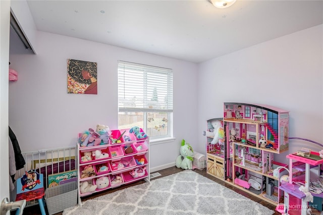 9211 Carys St SE, Yelm, WA 98597 - playroom featuring baseboards and wood finished floors