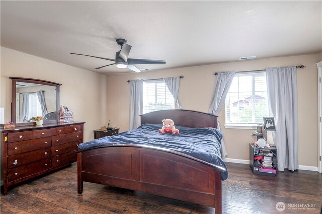 9211 Carys St SE, Yelm, WA 98597 - bedroom featuring multiple windows, dark wood finished floors, and a ceiling fan