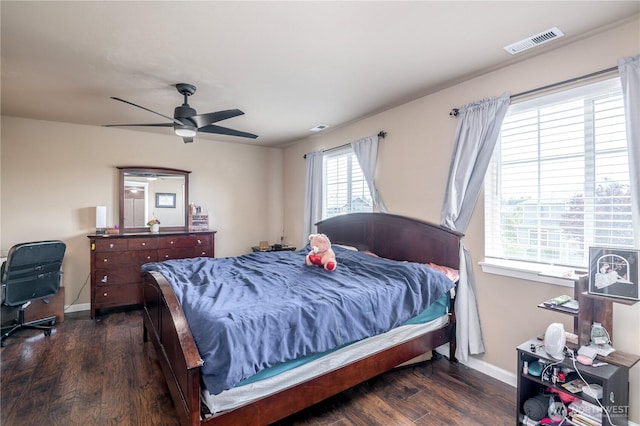 9211 Carys St SE, Yelm, WA 98597 - bedroom featuring dark wood-type flooring and a ceiling fan