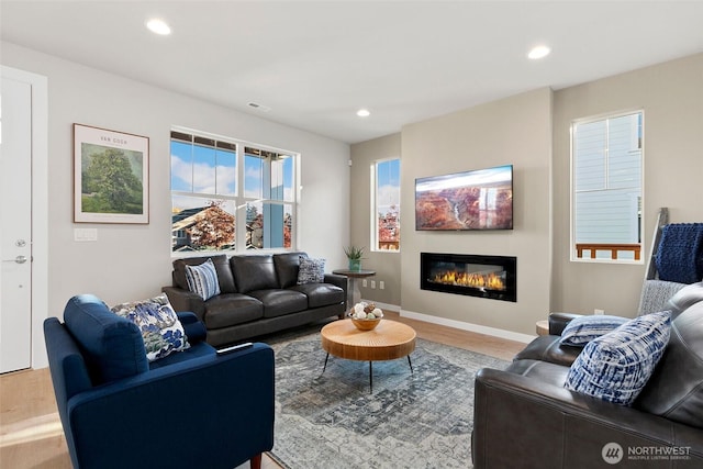 9802 5th Ln SW Unit 17, Seattle, WA 98106 - living room with wood finished floors, recessed lighting, and a glass covered fireplace