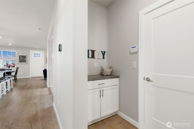 9802 5th Ln SW Unit 17, Seattle, WA 98106 - corridor with light wood-style flooring and recessed lighting