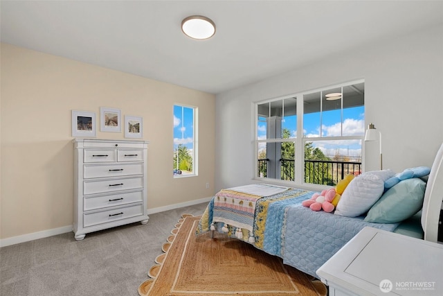 9802 5th Ln SW Unit 17, Seattle, WA 98106 - bedroom with light carpet and baseboards
