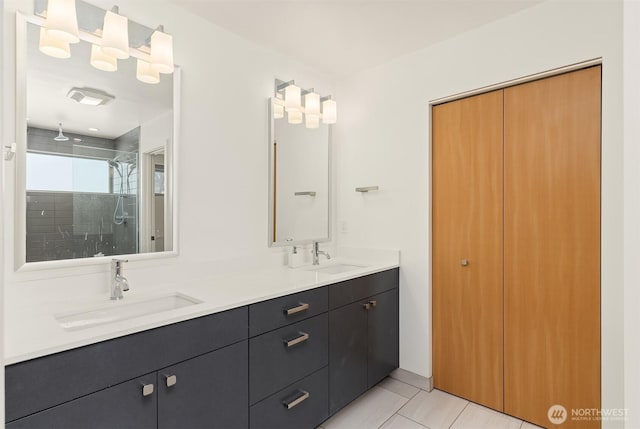 933 16th Avene, Seattle, WA 98122 - bathroom with a tile shower, double vanity, and tile patterned floors