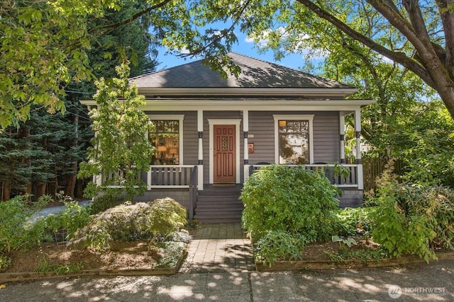 5825 4th Ave NW, Seattle, WA 98107 - view of front of house with a porch and roof with shingles