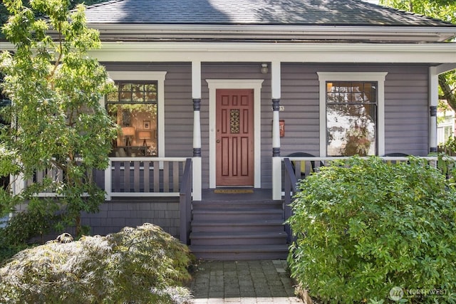 5825 4th Ave NW, Seattle, WA 98107 - doorway to property featuring a porch and a shingled roof