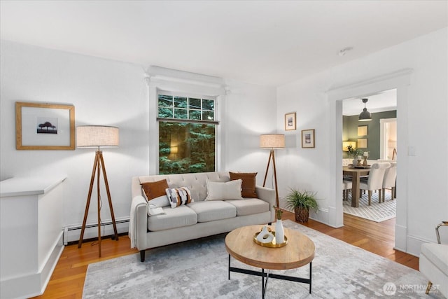 5825 4th Ave NW, Seattle, WA 98107 - living area featuring baseboard heating and wood finished floors