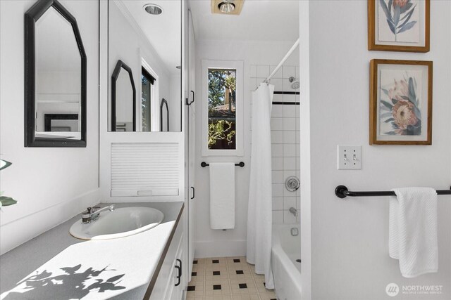 5825 4th Ave NW, Seattle, WA 98107 - bathroom featuring vanity, shower / bath combo with shower curtain, and tile patterned floors