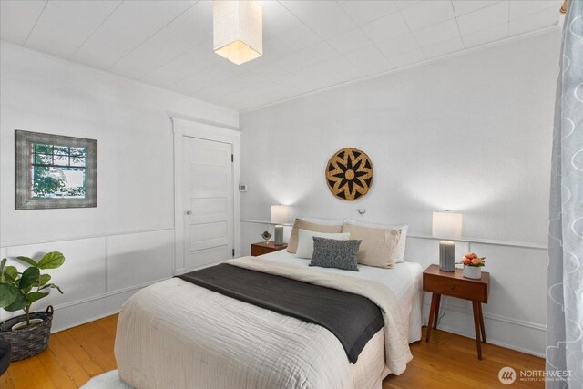 5825 4th Ave NW, Seattle, WA 98107 - bedroom featuring wood finished floors and crown molding