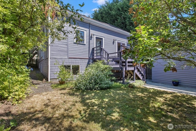 5825 4th Ave NW, Seattle, WA 98107 - rear view of house with a yard and stairs