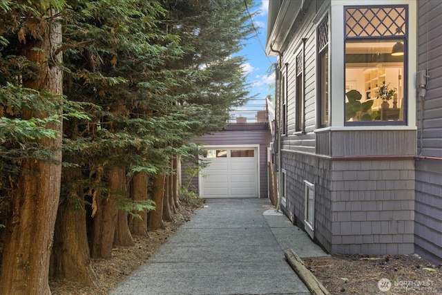 5825 4th Ave NW, Seattle, WA 98107 - view of home's exterior featuring driveway and a garage