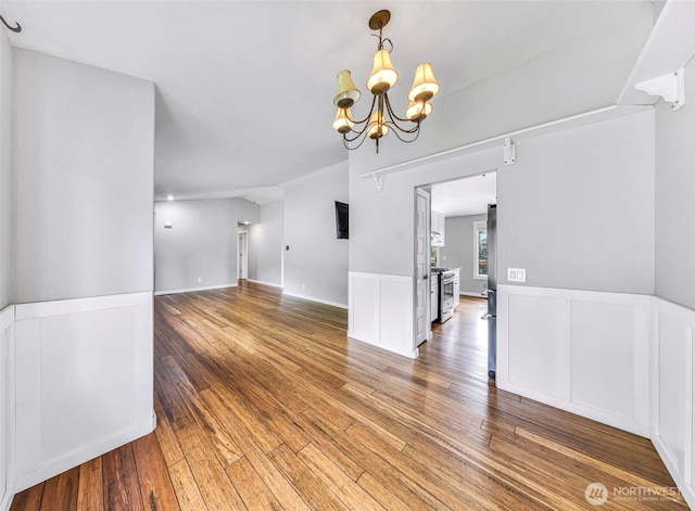 3919 Timothy Ct, Bellingham, WA 98226 - unfurnished room featuring wood-type flooring, a chandelier, and wainscoting