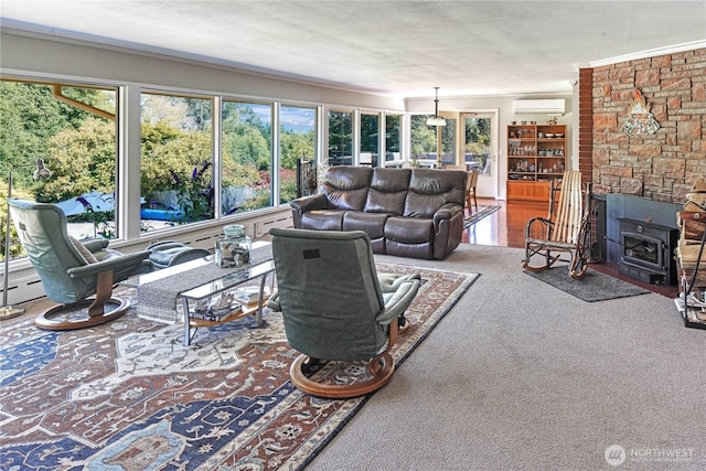 15638 94th Ave SW, Vashon, WA 98070 - living room featuring healthy amount of natural light, a wall mounted air conditioner, carpet, a wood stove, and a textured ceiling