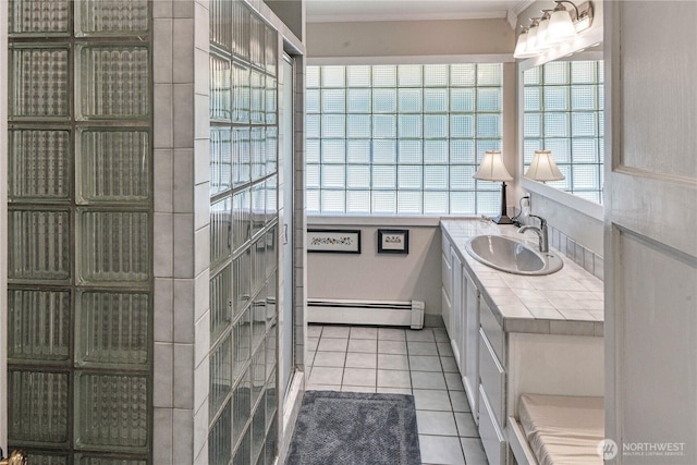 15638 94th Ave SW, Vashon, WA 98070 - bathroom with baseboard heating, vanity, tile patterned flooring, and crown molding