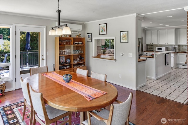 15638 94th Ave SW, Vashon, WA 98070 - dining space featuring crown molding and light wood finished floors