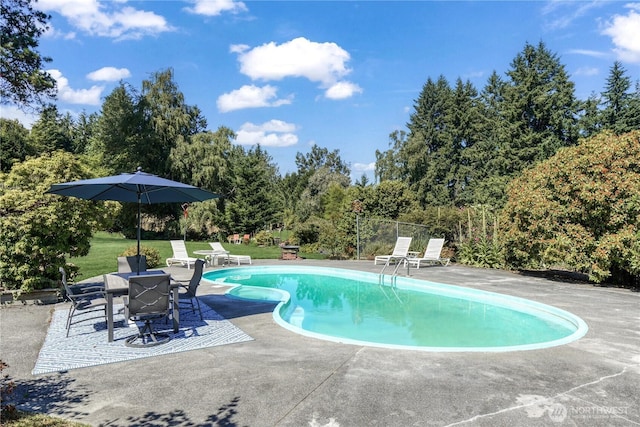 15638 94th Ave SW, Vashon, WA 98070 - swimming pool with a patio and view of wooded area