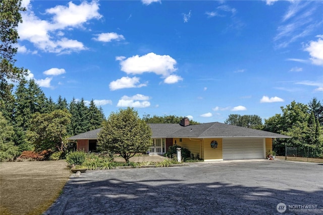 15638 94th Ave SW, Vashon, WA 98070 - single story home featuring an attached garage, driveway, and a chimney