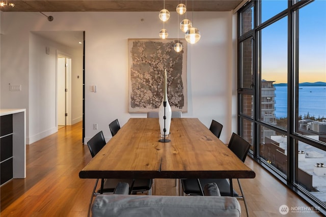 2911 2nd Ave Unit 1120, Seattle, WA 98121 - dining space featuring wood finished floors and expansive windows