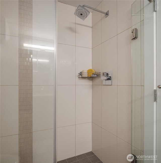 2911 2nd Ave Unit 1120, Seattle, WA 98121 - bathroom with tiled shower and tile walls