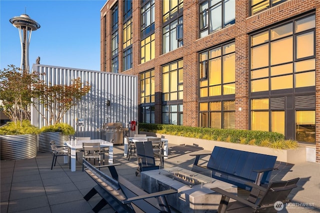 2911 2nd Ave Unit 1120, Seattle, WA 98121 - view of patio / terrace featuring a fire pit and outdoor dining area