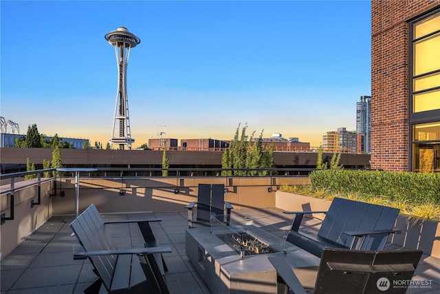 2911 2nd Ave Unit 1120, Seattle, WA 98121 - view of patio with an outdoor fire pit and a view of city