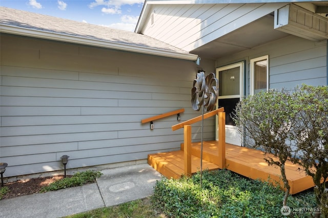 1726 Ann St NE, Olympia, WA 98506 - view of exterior entry featuring a wooden deck and roof with shingles