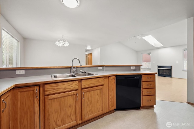 1726 Ann St NE, Olympia, WA 98506 - kitchen featuring black dishwasher, a skylight, open floor plan, light flooring, and a fireplace