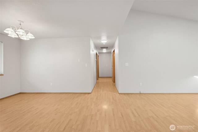 1726 Ann St NE, Olympia, WA 98506 - empty room featuring light wood-type flooring and a chandelier