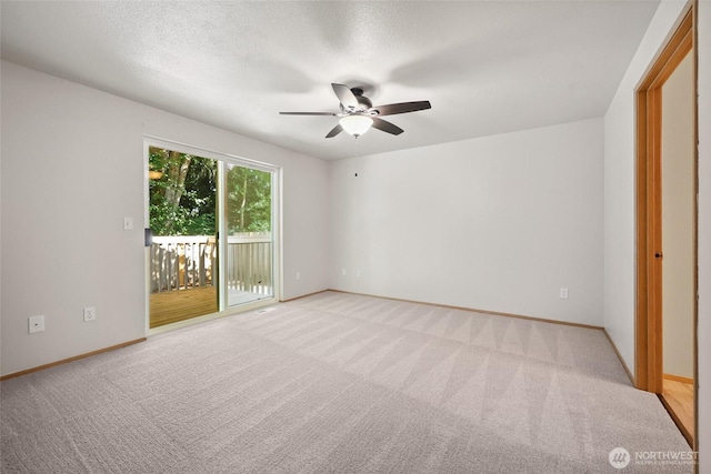 1726 Ann St NE, Olympia, WA 98506 - unfurnished bedroom featuring access to outside, light colored carpet, and a ceiling fan