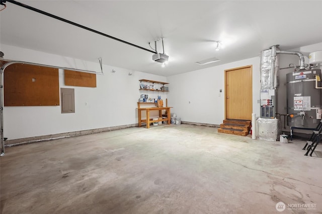 1726 Ann St NE, Olympia, WA 98506 - garage with water heater, a workshop area, and a garage door opener