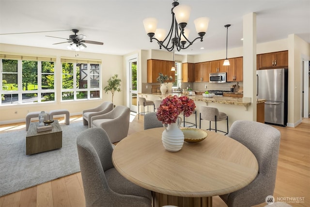 1840 25th Ave NE Unit 210, Issaquah, WA 98029 - dining area with plenty of natural light, light wood-type flooring, ceiling fan, and recessed lighting