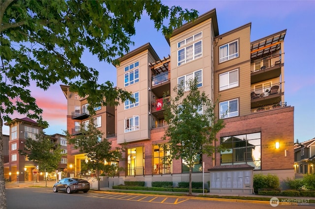 1840 25th Ave NE Unit 210, Issaquah, WA 98029 - property at dusk with a view of apartment building / complex