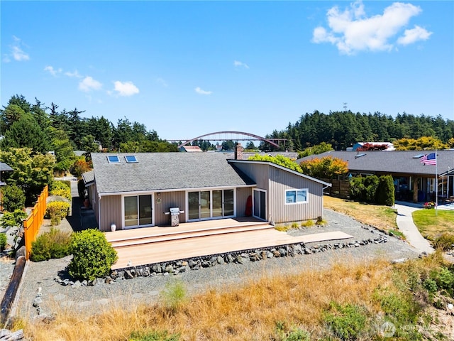 145 Lummi Dr, La Conner, WA 98257 - back of house featuring a deck and roof with shingles